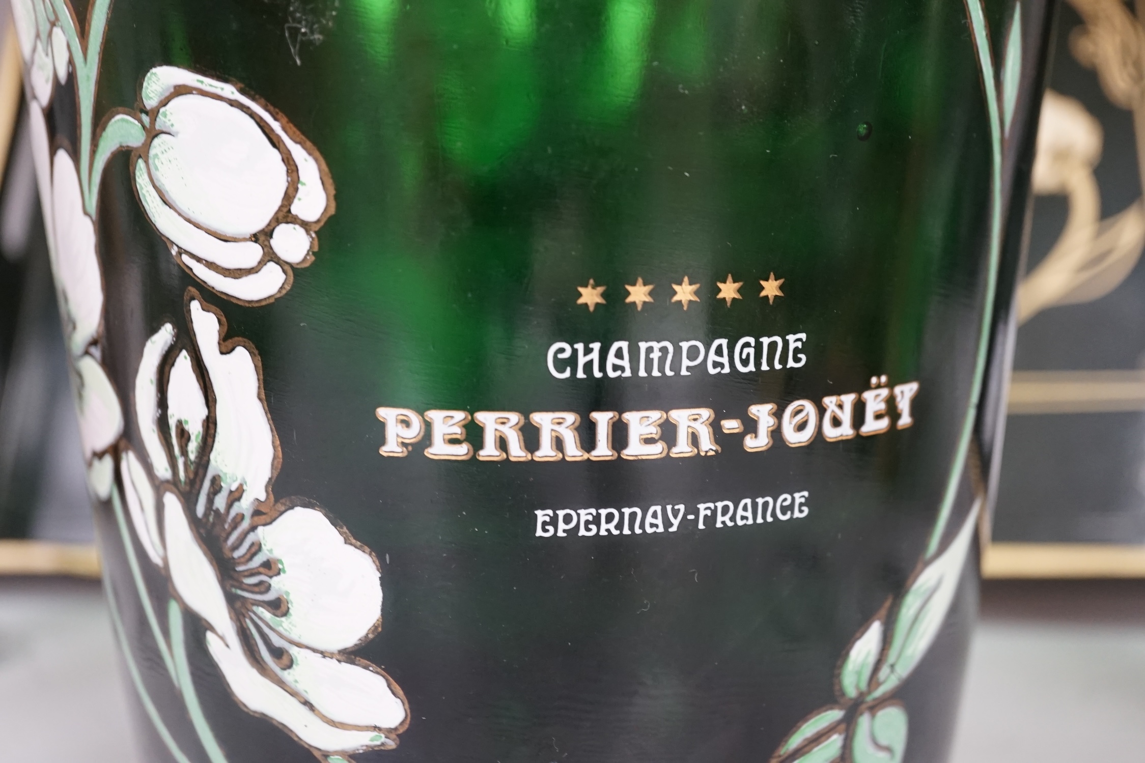 After an Emile Galle design, a Perrier Jouet ‘Belle Epoque’ champagne bucket, seven glass champagne flutes and a tray, largest 48cm wide. Condition - fair.